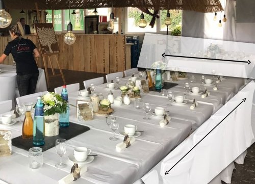 Weiße Tischdecke einer festlichen Tafel in der Gastronomie Weiße Tischdecke einer festlichen Tafel in der Gastronomie