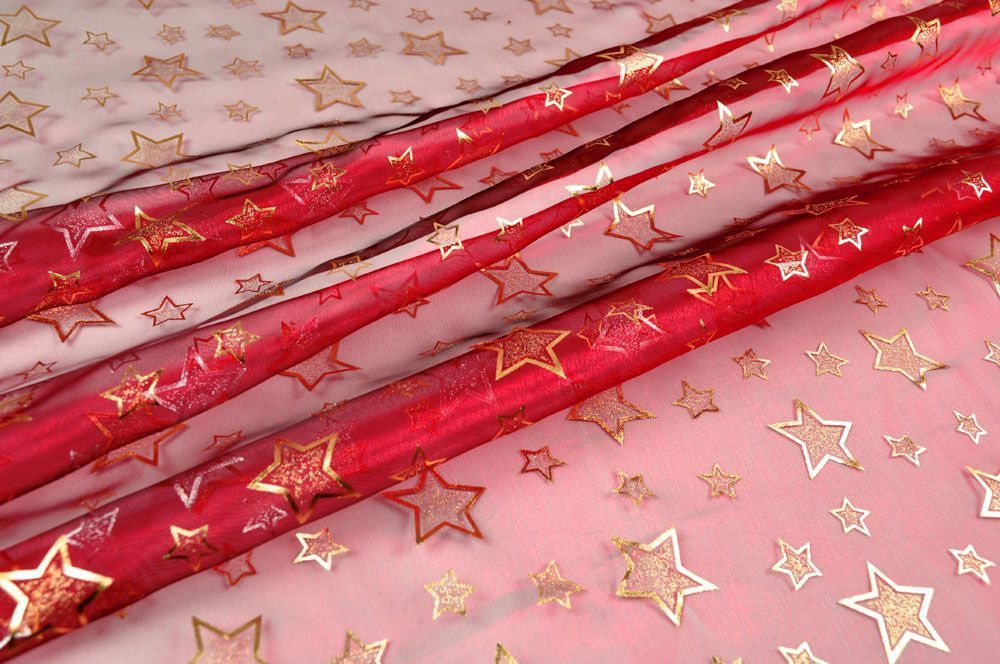 Dekorationsstoff rot mit goldenen Sternen