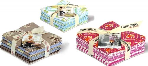 Pakete aus Patchwork-Stoffen farblich sortiert Pakete aus Patchwork-Stoffen farblich sortiert