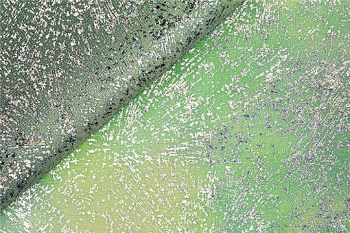 Ein knalliger Glanzstoff mit Farbverlauf und Metallic-Effekt – perfekt für spektakuläre Outfits auf der Bühne. Bk7812 Tanzkleiderstoff Jupiter Grn Fasnacht Stoffe bunt Lycra Tanzkleiderstoff - Aurora - GrünSchimmernder Elastikstoff mit Farbverlauf und silbernen Sprenkeln