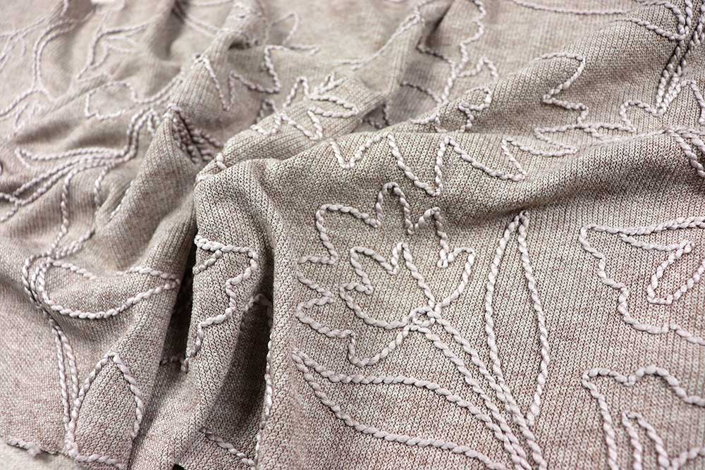 Strickstoff Blumenstick - Sand 