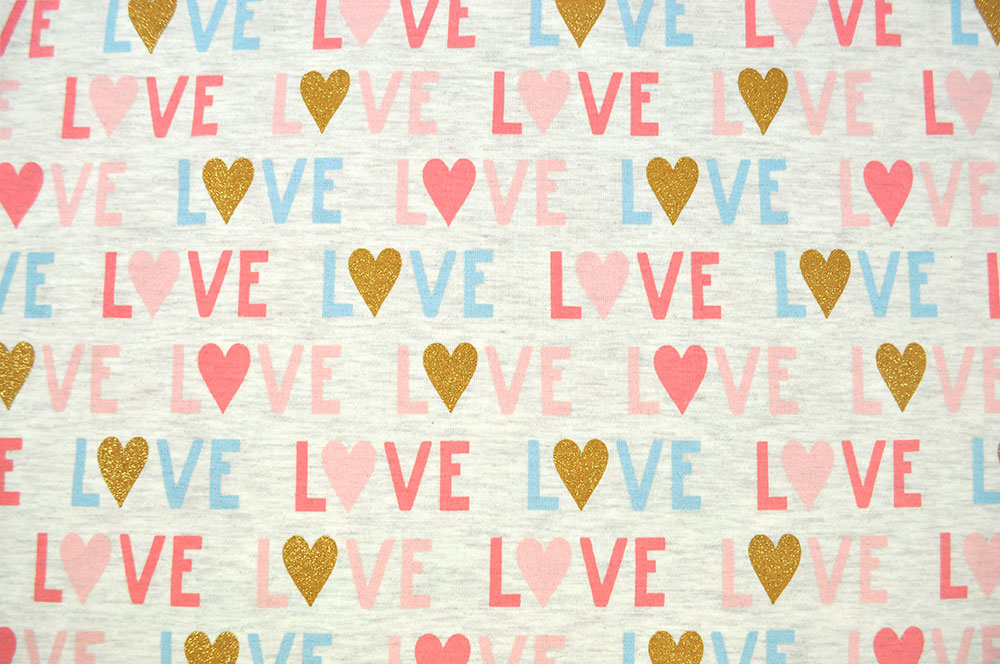 Toller elastischer Stoff mit glitzerndem Motiv - super für Bekleidung und mehr!  Bk7110 Glitzer Jersey Melange Love Creme S4 Sale Glitzerjersey - LOVE - Creme Melange
