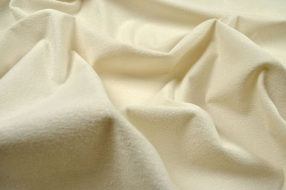 Der einseitig beschichtete Frotteestoff in Creme ist wasserdicht, die weiche Frotteeseite ist angenehm auf der Haut Tg1114 Frottee Wasserabweisend Creme Frottee Stoff Frottee - wasserdicht - Creme