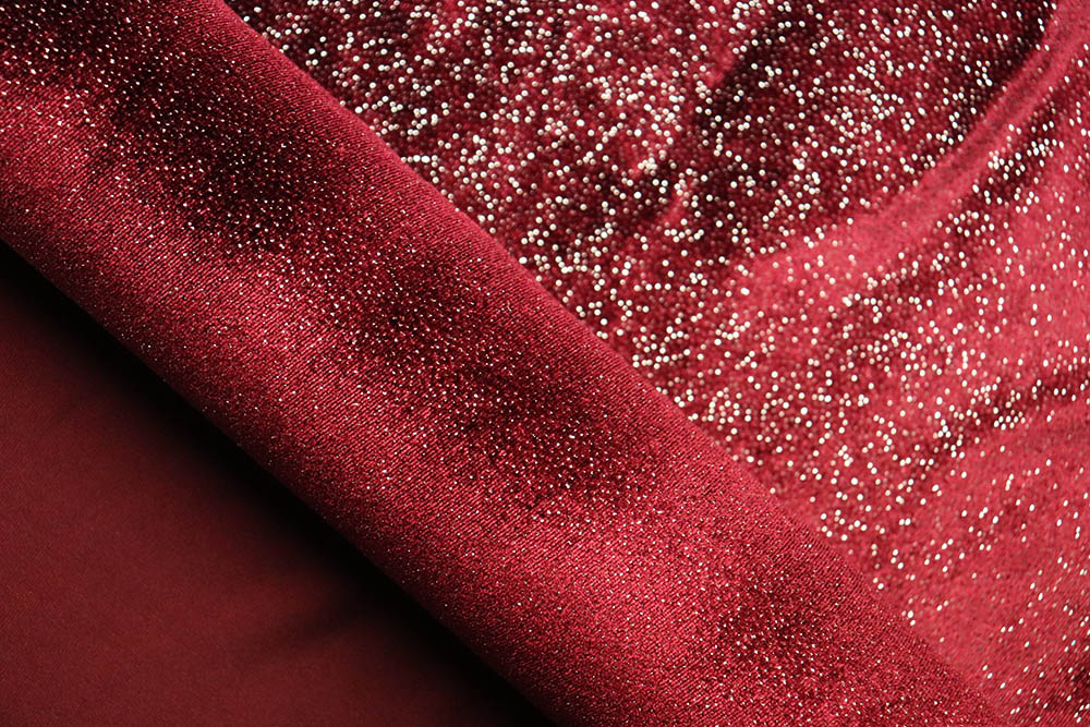 Blickdichter Bekleidungsstoff mit hohem Elasthan-Anteil und glitzernden Sprenkeln - samtweich, geschmeidig und absolut edel! Bk6915 Tanzkleiderstoff Glitzer Bordeaux Elastikstoffe Tanzkleiderstoff Queen - Bordeaux